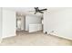 This upstairs bedroom has carpet floors, a ceiling fan, and neutral-colored walls at 4650 Blue Marlin Way, Indianapolis, IN 46239
