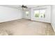 This extra large bedroom has carpet floors, a ceiling fan, and natural lighting at 4650 Blue Marlin Way, Indianapolis, IN 46239