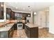Modern kitchen with dark cabinetry, stainless steel appliances, and a functional island, ideal for everyday cooking and gatherings at 4650 Blue Marlin Way, Indianapolis, IN 46239