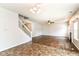 Open living space features a staircase and transitions to tile flooring in adjacent area at 4650 Blue Marlin Way, Indianapolis, IN 46239