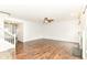 Hardwood floors and fireplace enhance the living room's comfort, leading to a hallway at 4650 Blue Marlin Way, Indianapolis, IN 46239