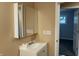Bathroom vanity featuring a mirrored cabinet and white sink at 501 W Taylor St, Alexandria, IN 46001