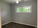 Bedroom with neutral walls, carpeted floor, and a window at 501 W Taylor St, Alexandria, IN 46001