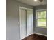 Bedroom with hardwood floors, neutral walls, a window, and closet at 501 W Taylor St, Alexandria, IN 46001
