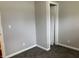 Empty bedroom showing gray walls, carpet, and a door at 501 W Taylor St, Alexandria, IN 46001