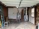 Spacious garage interior showing mechanicals and access door at 501 W Taylor St, Alexandria, IN 46001