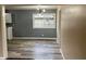 Bright dining area featuring new floors, modern lighting, and view into the kitchen at 501 W Taylor St, Alexandria, IN 46001