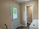 Bright laundry room features neutral walls, wood-look flooring, and exterior access at 501 W Taylor St, Alexandria, IN 46001