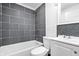 This bathroom features a tub and shower combo and a single sink vanity with a mirror at 541 Dayton Ave, Indianapolis, IN 46203
