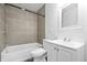 This bathroom features a bathtub, shower and single sink vanity with plenty of counter space at 541 Dayton Ave, Indianapolis, IN 46203
