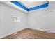 Bright bedroom featuring stylish wood-look flooring and a large window, creating a bright and inviting space at 541 Dayton Ave, Indianapolis, IN 46203