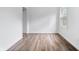 This bedroom is bright and open, featuring wood-look floors and a large window at 541 Dayton Ave, Indianapolis, IN 46203
