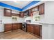 This kitchen features stainless steel appliances, wood cabinets and marble countertops at 541 Dayton Ave, Indianapolis, IN 46203