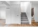 Well-lit stairway with plush carpeting leading to additional living spaces and conveniently located near a bathroom at 541 Dayton Ave, Indianapolis, IN 46203