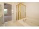 Bathroom featuring a bathtub with jets, a shower, and large window at 5883 Sandalwood Dr, Carmel, IN 46033