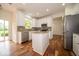 Modern kitchen with granite countertops, stainless steel appliances, and white cabinetry at 5883 Sandalwood Dr, Carmel, IN 46033