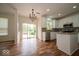 Bright eat-in kitchen with granite counters, stainless appliances, and sliding glass doors to patio at 5883 Sandalwood Dr, Carmel, IN 46033