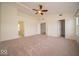 Large main bedroom with a vaulted ceiling, ceiling fan, and walk-in closet at 5883 Sandalwood Dr, Carmel, IN 46033