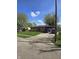 Lovely home exterior with a lush green lawn, driveway, and mature trees on a sunny day at 6133 Ashway Ct, Indianapolis, IN 46224
