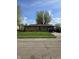 Charming brick home with a well-manicured lawn and driveway, perfect for suburban living at 6133 Ashway Ct, Indianapolis, IN 46224