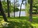 Scenic view of a lake surrounded by lush greenery and trees at 622 S Washington St, Morristown, IN 46161