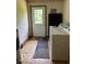 Functional laundry area with washer, dryer, and easy access to an exterior door at 622 S Washington St, Morristown, IN 46161