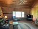 Comfortable living room with a stone fireplace, wood accents, and cozy seating at 622 S Washington St, Morristown, IN 46161