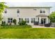 Well-maintained backyard featuring patio, lush lawn and home exterior at 6296 Sugar Maple Dr, Zionsville, IN 46077