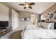 Inviting bedroom featuring soft carpet, ceiling fan and ensuite bathroom at 6296 Sugar Maple Dr, Zionsville, IN 46077
