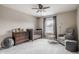 Cozy bedroom features a wood crib, dresser, comfortable chair and natural lighting at 6296 Sugar Maple Dr, Zionsville, IN 46077