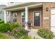 Inviting front porch with rocking chairs and decorative plants for curb appeal at 6296 Sugar Maple Dr, Zionsville, IN 46077
