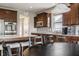 Well-equipped kitchen with stainless steel appliances, granite countertops and an adjacent dining area at 6296 Sugar Maple Dr, Zionsville, IN 46077