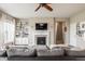 Inviting living room featuring a fireplace and custom built-in shelving at 6296 Sugar Maple Dr, Zionsville, IN 46077
