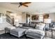 Open-concept living room with a large sectional sofa and seamless flow to the kitchen at 6296 Sugar Maple Dr, Zionsville, IN 46077