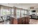 Open floor plan showcasing living room with fireplace and comfortable seating, next to bright dining area at 6296 Sugar Maple Dr, Zionsville, IN 46077
