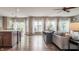 Spacious living room with hardwood floors and an open layout leading to the kitchen at 6296 Sugar Maple Dr, Zionsville, IN 46077