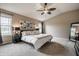 Bright main bedroom with accent wall, modern decor, and vaulted ceiling at 6296 Sugar Maple Dr, Zionsville, IN 46077
