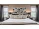 Beautiful bedroom with stylish accent wall, bedside lamps and windows at 6296 Sugar Maple Dr, Zionsville, IN 46077