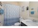 Well-lit bathroom featuring a patterned shower curtain and vanity with sink at 632 Albermarle Dr, Pittsboro, IN 46167