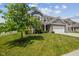 Well-maintained front lawn and exterior view of a two-story home with an attached garage at 632 Albermarle Dr, Pittsboro, IN 46167