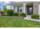 Inviting front porch with well-manicured landscaping, charming front door, and outdoor seating at 632 Albermarle Dr, Pittsboro, IN 46167