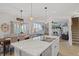 Open concept kitchen features a marble island, stainless steel appliances, and eat in kitchen at 632 Albermarle Dr, Pittsboro, IN 46167
