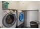 Practical laundry room with modern, front-load Samsung washer and dryer at 632 Albermarle Dr, Pittsboro, IN 46167
