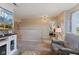 Open living room featuring neutral colors, a large TV, and cozy seating area at 632 Albermarle Dr, Pittsboro, IN 46167