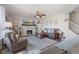 Spacious living room with fireplace, tv, ceiling fan and plush seating area at 632 Albermarle Dr, Pittsboro, IN 46167