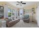Inviting sitting room features large windows providing ample natural light and plush seating at 632 Albermarle Dr, Pittsboro, IN 46167