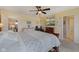 Relaxing main bedroom has large windows and a TV with fireplace at 632 Albermarle Dr, Pittsboro, IN 46167