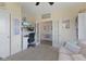 Bright office with French doors and a work space with a mounted television at 632 Albermarle Dr, Pittsboro, IN 46167