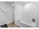 Bathroom featuring a standalone bathtub, sleek fixtures, and minimalist decor at 6507 W Whispering Way, Greenfield, IN 46140