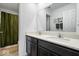 Bathroom featuring a double vanity with quartz countertops, modern fixtures, and stylish mirror at 6507 W Whispering Way, Greenfield, IN 46140
